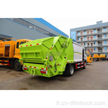 Camion à ordures compacteur de récipient à déchets de bras hydraulique